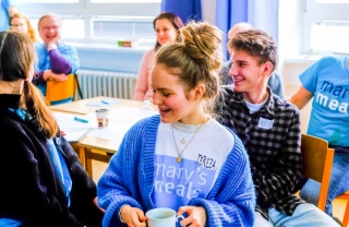 Volunteers share ideas at a meeting