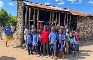 A group of children outside a school in Mozambique