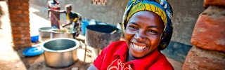 A volunteer cook in Zambia smiles