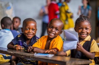 Children smiling in class in Liberia