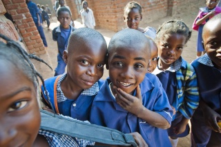 Boys joke and pose together in Zambia