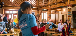 A fundraiser in the Czech Republic talks to a crowd