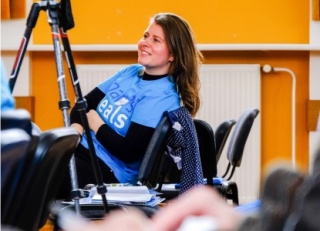 A volunteer listens to a speech