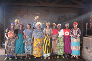 Nizigiyimana and other volunteer cooks standing in their kitchen.