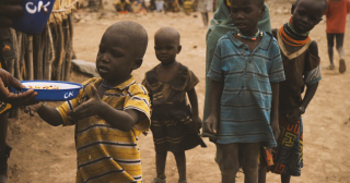 Child receiving meal, Turkana, Kenya