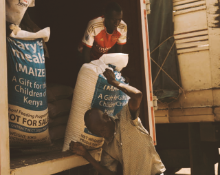 Mary's Meals sacks being unloaded from supplier into warehouse - Turkana, Kenya