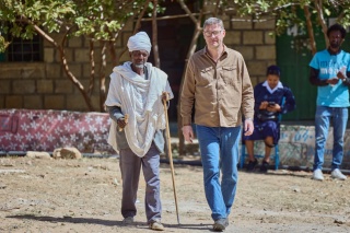 Magnus MacFarlane-Barrow consults with village elders, who have responsibility for delivery the school feeding programme 