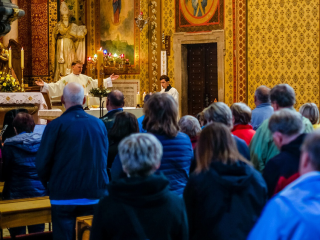 Priest giving mass. 