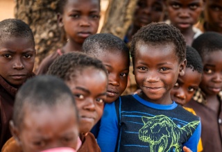 Children huddle together at school