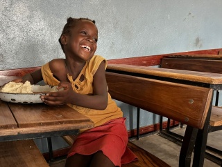 A child in a classroom in Mozambique